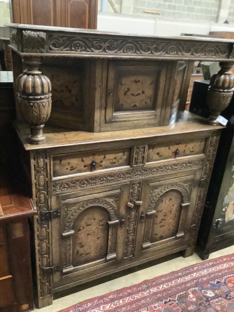 A reproduction 17th century style marquetry inlaid oak court cupboard, length 122cm, depth 43cm, height 155cm